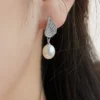 1 Pair IG Style Simple Style Wings Plating Inlay Sterling Silver Pearl Zircon Drop Earrings